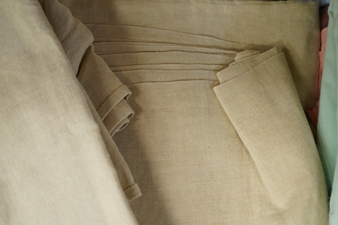 Ten French provincial cream coarse linen sheets, two unused with original Galleries Lafayette labels
